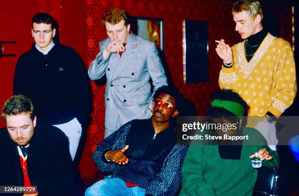 View of, from left, English musicians Jerry Dammers, Steve White, Mick Talbot, Junior Giscombe, Dee C Lee, and Paul Weller, Red Wedge Tour,...