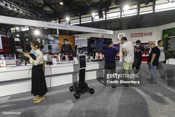 Attendees at the Lenovo Group Ltd. Booth at the MWC Shanghai event in Shanghai, China, on Thursday, June 29, 2023. The Shanghai event is modeled...