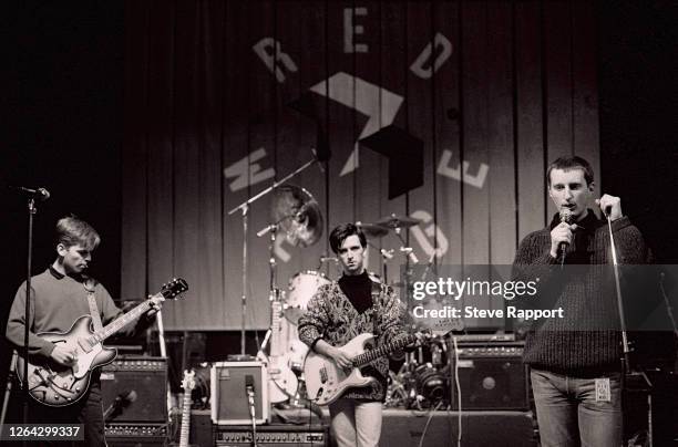 View of, from left, English musicians Andy Rourke and Johnny Marr, both of the group the Smiths, and Billy Bragg rehearse during a soundcheck on the...