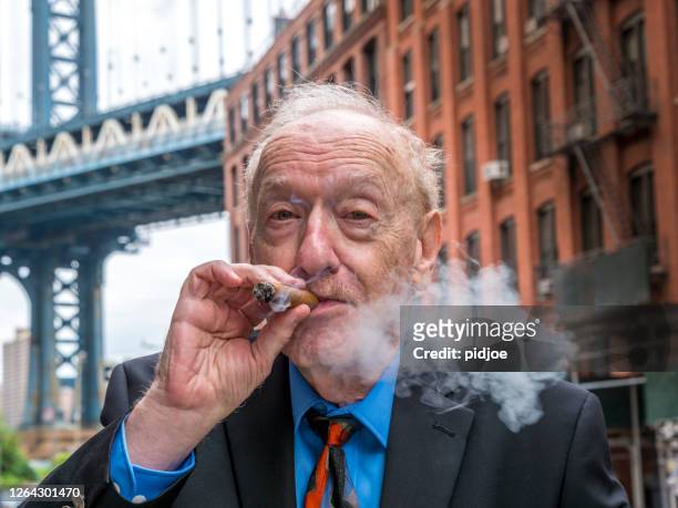 portrait of a typical new york senior man, with cigar - smoking cigar stock pictures, royalty-free photos & images