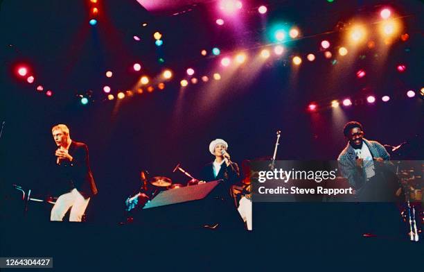 View of from, fore from left, English Pop and Rock musicians Paul Weller and Dee C Lee, both of the group the Style Council, and Junior Giscombe, as...