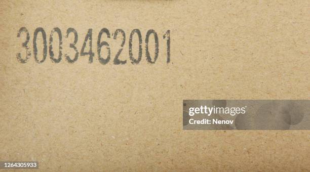 smooth surface of cardboard box with number - carton stock pictures, royalty-free photos & images