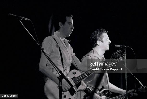 English Punk Rock musicians Mick Jones and Joe Strummer, both of the group the Clash, perform at the Lyceum, London, .