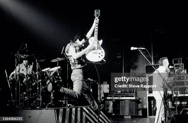 English Punk Rock musicians, from left, Topper Headon , Mick Hones, and Joe Strummer, all of the group the Clash, perform at the Brixton Fair Deal ,...