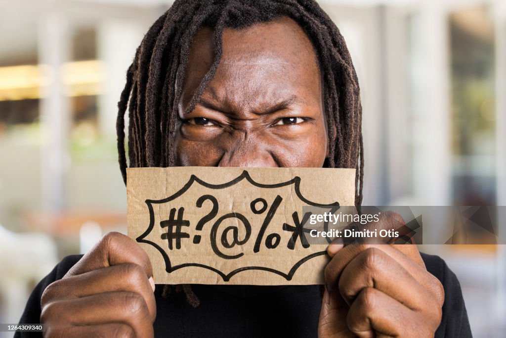 Swearing In Sign Angry Man Holding Sign With Swearing Cussing Symbols High-Res Stock ...