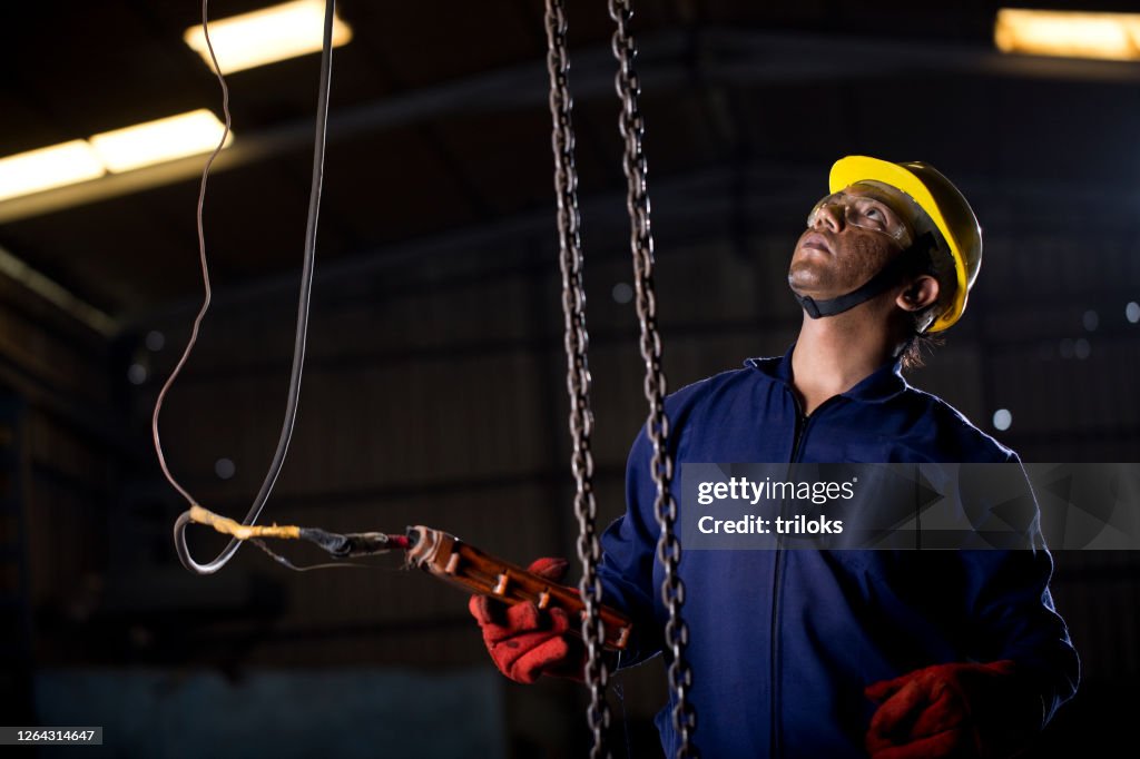 Engineer Chain Management Male Engineer Adjusting Chain Hoist At Industry High-Res Stock Photo ...