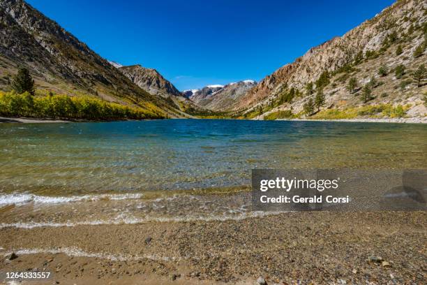 lundy lake on the east side of the sierra nevada mountain with autumn aspens. - lundy canyon stock pictures, royalty-free photos & images