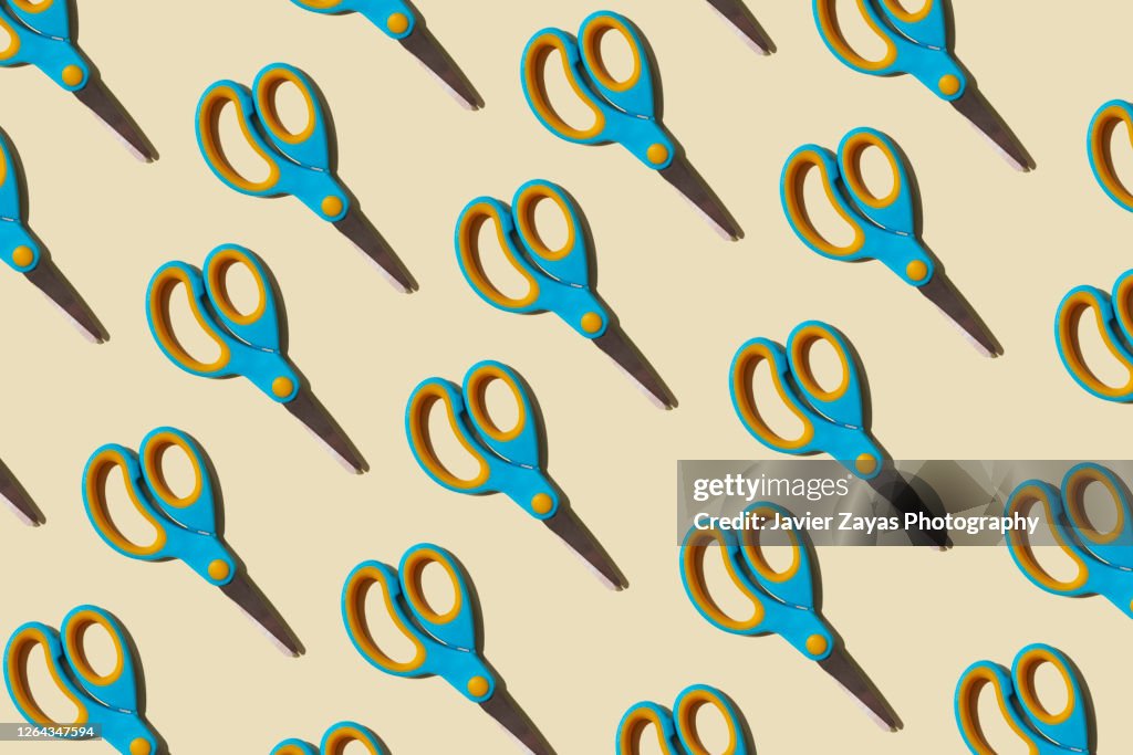 Many Scissors On A Pastel Background