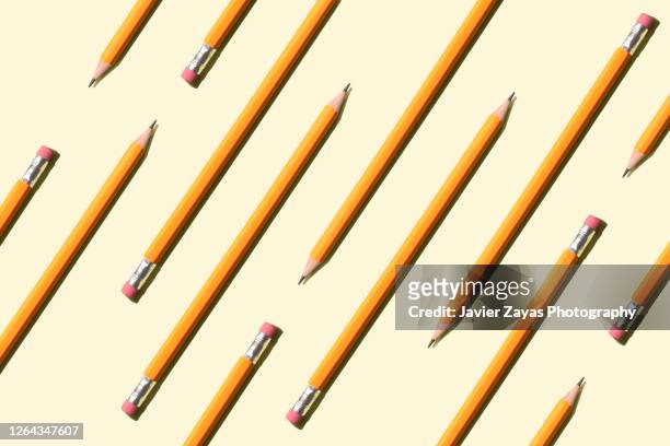 many pencils on a pastel background - pencil with rubber stock pictures, royalty-free photos & images