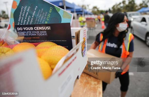 Boxes of food are distributed by the Los Angeles Regional Food Bank to people facing economic or food insecurity amid the COVID-19 pandemic on August...