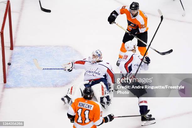 Scott Laughton of the Philadelphia Flyers scored a goal on Braden Holtby of the Washington Capitals during the first period in the Eastern Conference...