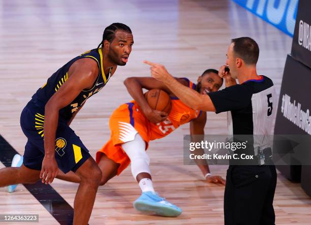 Referee Kane Fitzgerald calls a foul as T.J. Warren of the Indiana Pacers and Mikal Bridges of the Phoenix Suns look on during the third quarter at...