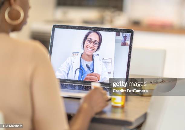 remote medical appointment - remote stock pictures, royalty-free photos & images