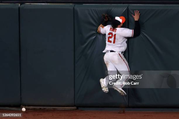 Centerfielder Austin Hays of the Baltimore Orioles miss plays an RBI triple hit by Brian Anderson of the Miami Marlins in the seventh inning at...
