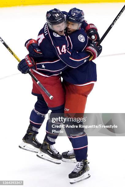 Seth Jones of the Columbus Blue Jackets is congratulated by his teammate Gustav Nyquist after scoring a goal against the Toronto Maple Leafs during...