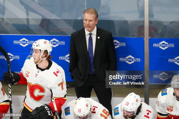 Geoff Ward head coach of the Calgary Flames looks on against the Winnipeg Jets during the first period in Game Four of the Western Conference...