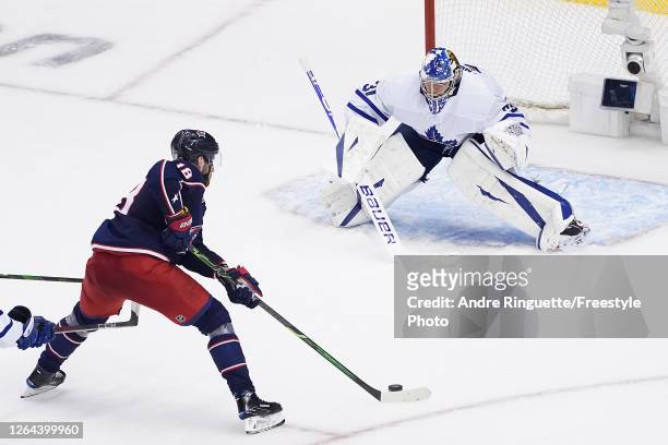 Pierre-Luc Dubois of the Columbus Blue Jackets scores the game-winning goal past Frederik Andersen of the Toronto Maple Leafs during the first...