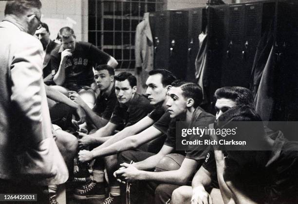 Dean Smith of the Kansas Jayhawks sits in the locker room before taking on the St. John"u2019s Redmen during the NCAA Championship on March 26, 1952...