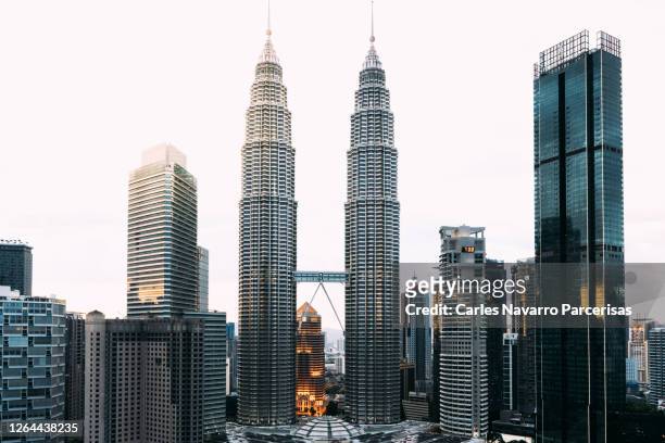 petronas towers and skyscrapers in the city of kuala lumpur in malaysia. travel concept - kuala lumpur stock pictures, royalty-free photos & images