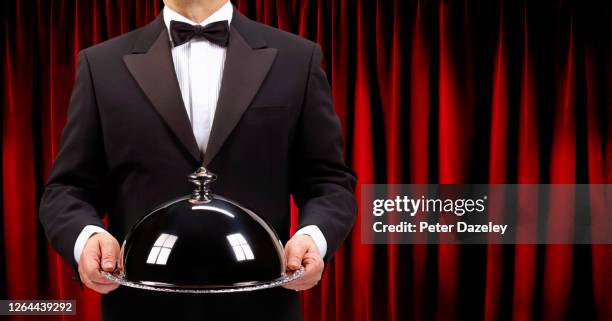 butler holding domed serving dish - cloche stock pictures, royalty-free photos & images