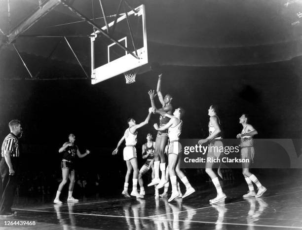 Wilt Chamberlain of the Kansas Jayhawks shoots the ball against the North Carolina Tar Heels during the NCAA Final Four National Championship game on...