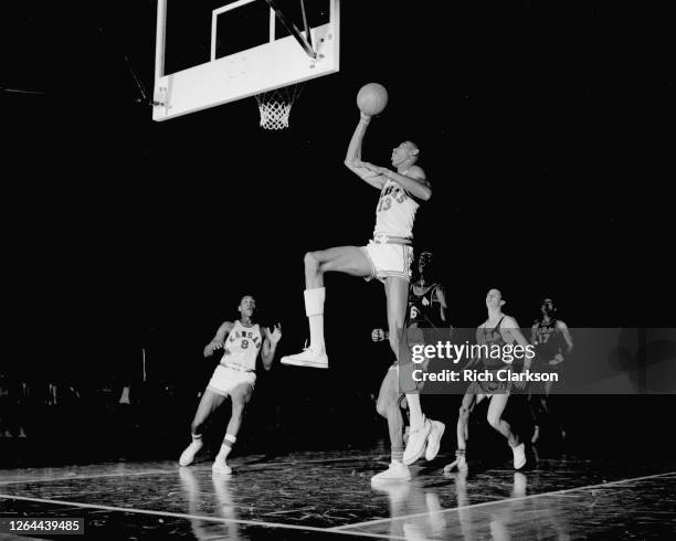 Wilt Chamberlain of the Kansas Jayhawks shoots the ball against the University of San Francisco Dons during the NCAA Final Four National semifinal...