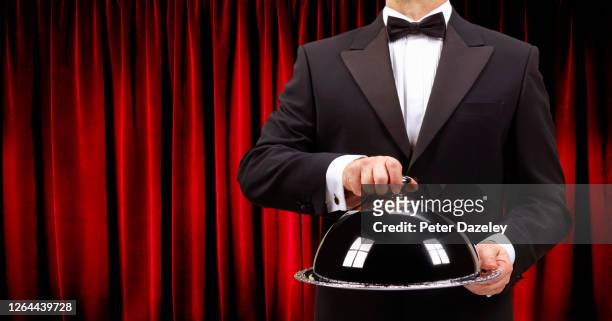 butler holding domed serving dish - cloche stock pictures, royalty-free photos & images