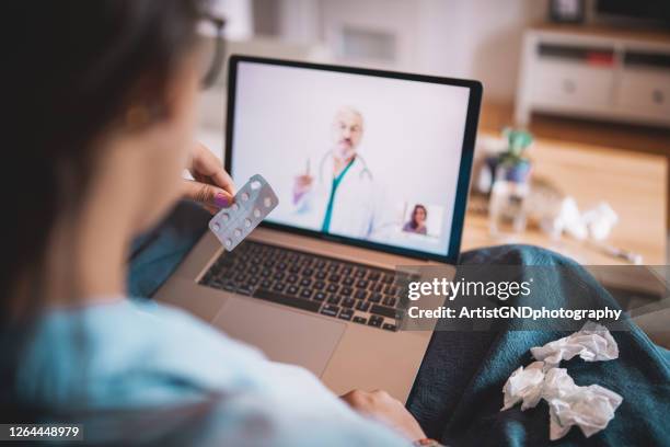 young woman is having online consultation with her healthcare person - contraceptive stock pictures, royalty-free photos & images