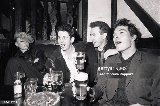 Members of the Pogues, 11/30/84. Pictured are Shane MacGowan, Cait O'Riordan, Andrew Rankin, Jem Finer.