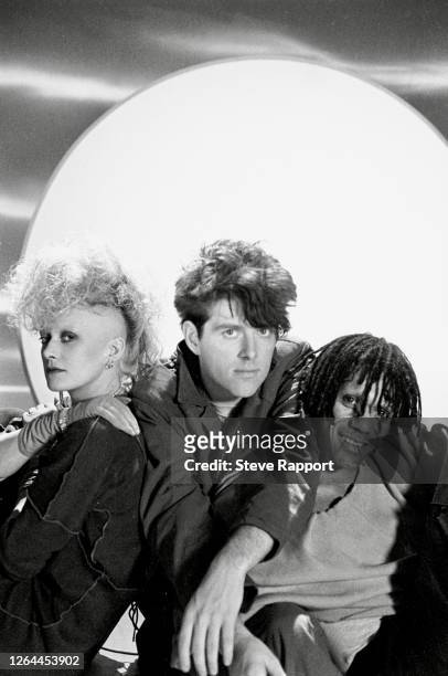 English New Wave and Synthpop group Thompson Twins film the 'Doctor Doctor' music video, 1/25/1984. Pictured are Alanna Currie , Tom Bailey , and Joe...