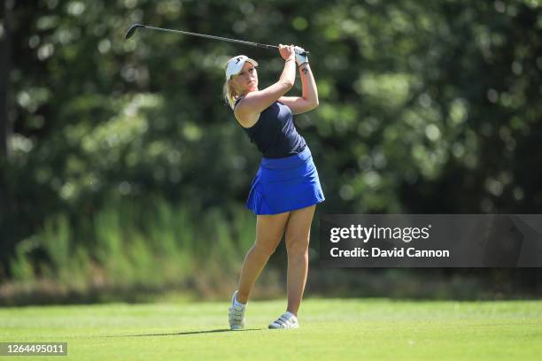 Cloe Frankish of England plays her second shot on the first hole during day three of The Rose Ladies Series on The West Course at Wentworth Golf Club...