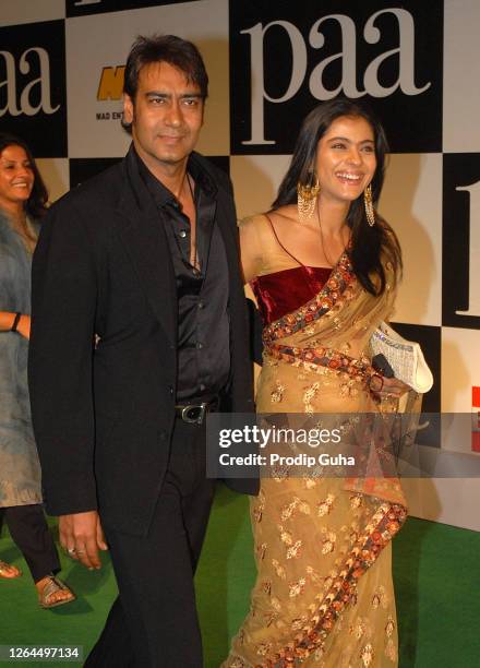 Ajay Devgn and Kajol Devgn attend the film premiere of “PAA" on December 03, 2009 in Mumbai, India.