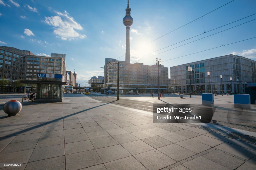 Germany, Berlin, Sun shining over empty Alexanderplatz during COVID-19 pandemic