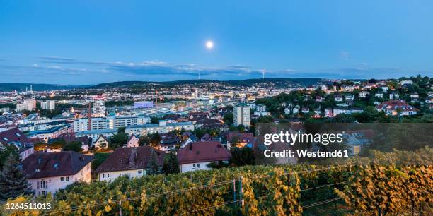 germany, baden-wurttemberg, stuttgart, moon glowing over houses in relenberg district - stuttgart panorama stock pictures, royalty-free photos & images