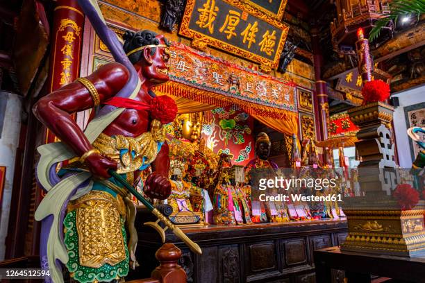 taiwan, tainan, altar and statue at grand mazu temple - tainan stock pictures, royalty-free photos & images