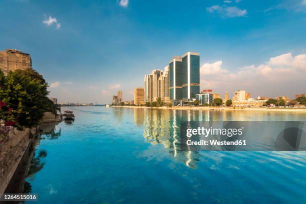 egypt, cairo, nile and towers of bank and financial district - egypt city stock pictures, royalty-free photos & images