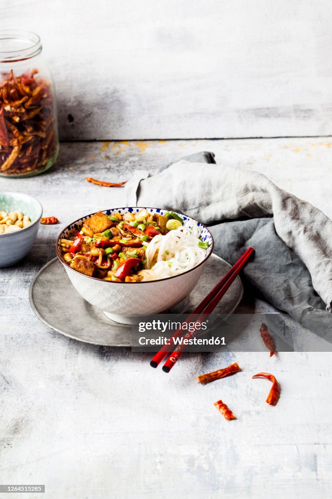 VeganKungPaowith tofu, capsicum, peanuts, rice noodles