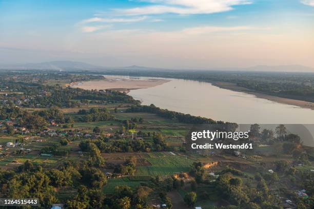 myanmar, kachin state, myitkyina, irrawaddy river in landscape - kachin stock-fotos und bilder