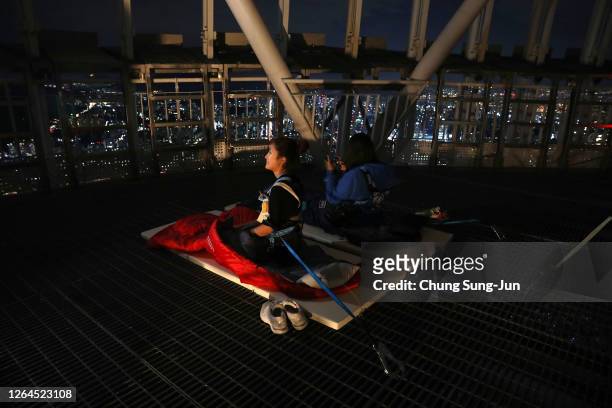 People enjoy camping at rooftop of the Lotte World Tower as a way to safely social distance while camping in an urban setting amid the coronavirus...