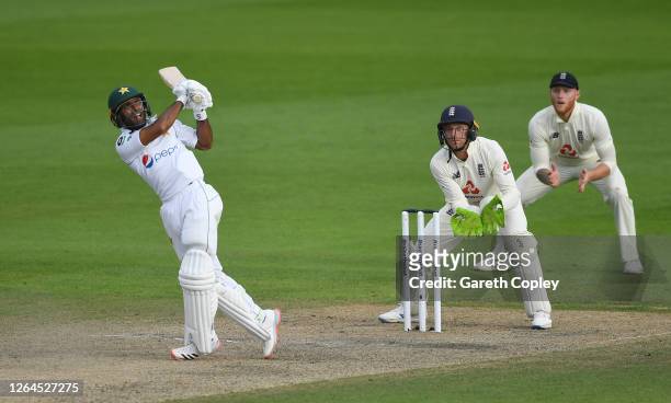 Asad Shafiq of Pakistan hits out watched on by Jos Buttler of England during Day Three of the 1st #RaiseTheBat Test Match between England and...