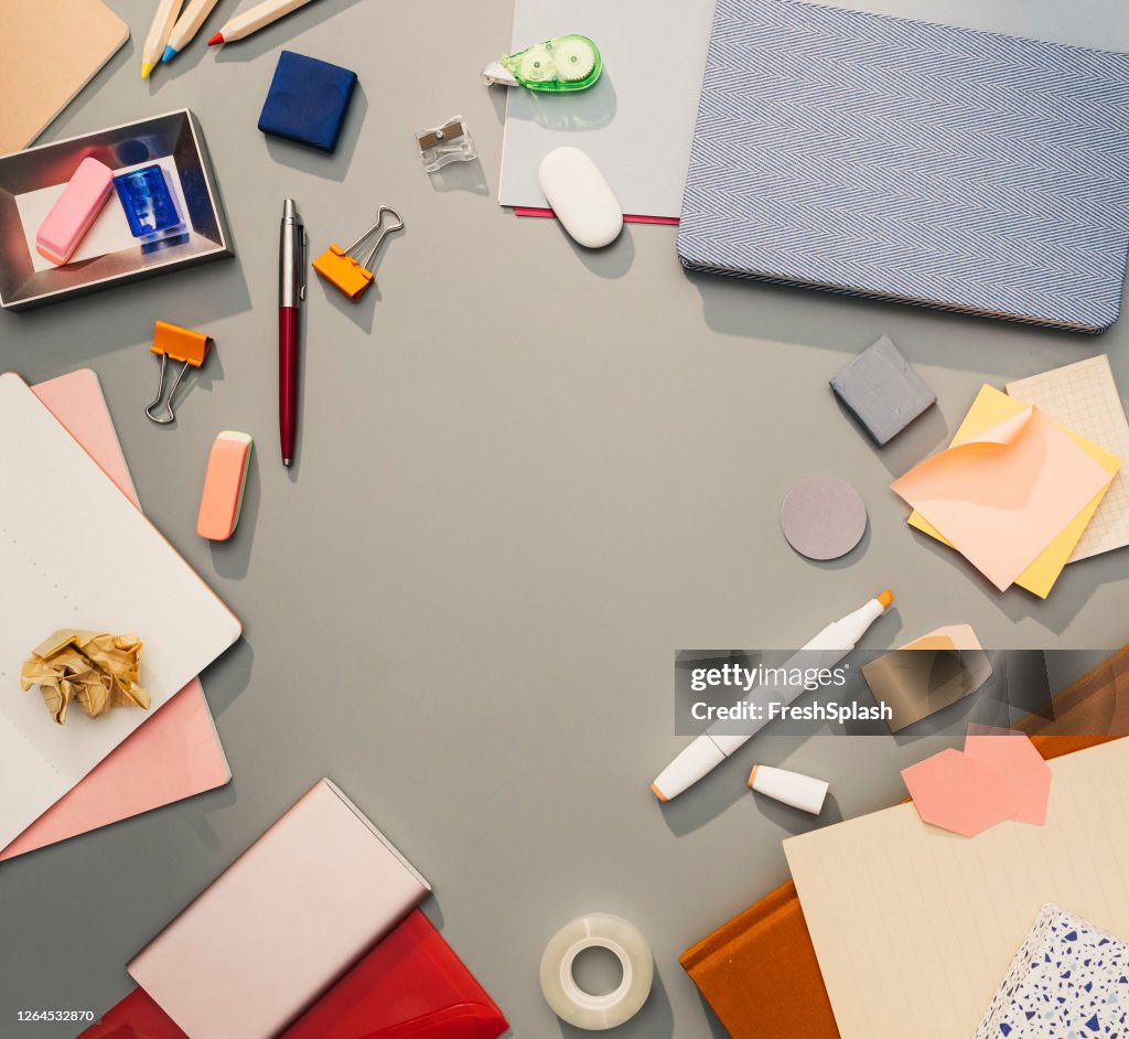 Flat Lay Still Life Comprising a Collection of Office-Related Objects Regularly Used on a Businessperson's Desk, Copy Space in the Middle