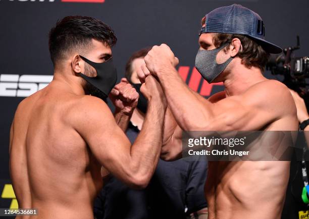 Opponents Nasrat Haqparast of Germany and Alexander Munoz face off during the UFC Fight Night weigh-in at UFC APEX on August 07, 2020 in Las Vegas,...