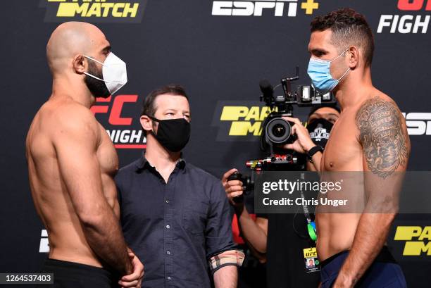 Opponents Omari Akhmedov of Russia and Chris Weidman face off during the UFC Fight Night weigh-in at UFC APEX on August 07, 2020 in Las Vegas, Nevada.