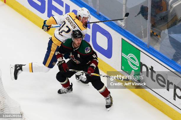 Niklas Hjalmarsson of the Arizona Coyotes skates against Ryan Johansen of the Nashville Predators in Game Four of the Western Conference...