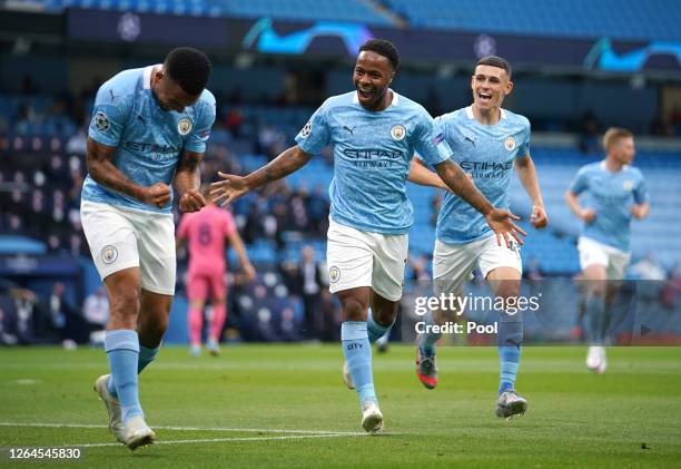 Raheem Sterling of Manchester City celebrates with teammate Gabriel Jesus after scoring his team's first goal during the UEFA Champions League round...