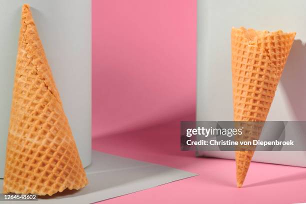 ice cream cones on white and pink background - cornet eis stock pictures, royalty-free photos & images