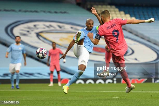 Karim Benzema of Real Madrid shoots during the UEFA Champions League round of 16 second leg match between Manchester City and Real Madrid at Etihad...