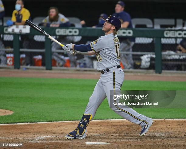 Justin Smoak of the Milwaukee Brewers hits a run scoring sacrifice fly against the Chicago White Sox at Guaranteed Rate Field on August 06, 2020 in...