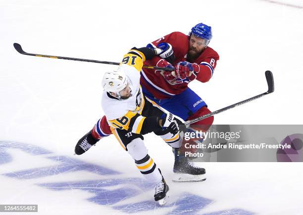 Jason Zucker of the Pittsburgh Penguins and Shea Weber of the Montreal Canadiens collide in the first period in Game Four of the Eastern Conference...