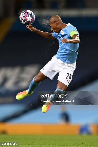 Fernandinho of Manchester City wins a header during the UEFA Champions League round of 16 second leg match between Manchester City and Real Madrid at...